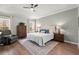 Spacious main bedroom features hardwood floors, neutral walls, and tray ceiling at 423 Treetop Cir, Canton, GA 30115