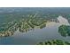 Picturesque aerial view of a lakeside community featuring lush golf course and stunning lake views at 1050 Carnoustie Ln, Alpharetta, GA 30005