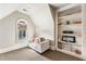 Attic featuring window, wall shelving, carpet, and sitting area at 1050 Carnoustie Ln, Alpharetta, GA 30005