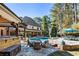 Backyard with a swimming pool, patio, and outdoor seating areas at 1050 Carnoustie Ln, Alpharetta, GA 30005