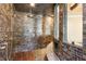 Luxurious shower showcasing intricate tilework, multiple shower heads, and stone accents at 1050 Carnoustie Ln, Alpharetta, GA 30005
