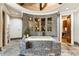 Spa-like bathroom with mosaic tile, soaking tub, and elegant fixtures at 1050 Carnoustie Ln, Alpharetta, GA 30005