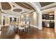 Open-concept dining room featuring a stylish table and chairs near a bar area at 1050 Carnoustie Ln, Alpharetta, GA 30005