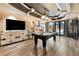 Entertainment space with pool table, built-in cabinetry, and access to the outdoor patio at 1050 Carnoustie Ln, Alpharetta, GA 30005