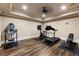 Well-equipped home gym with exercise machines and wood-look floors at 1050 Carnoustie Ln, Alpharetta, GA 30005