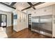 Bright kitchen featuring stainless steel refrigerator, white cabinets, and hardwood floors at 1050 Carnoustie Ln, Alpharetta, GA 30005