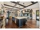 Spacious kitchen with stainless steel appliances, dark wood floors, and large island at 1050 Carnoustie Ln, Alpharetta, GA 30005