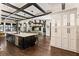 Gourmet kitchen with stainless steel appliances, large island, and dark wood floors at 1050 Carnoustie Ln, Alpharetta, GA 30005