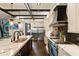 Open kitchen with stainless steel appliances, dark wood floors, and a large kitchen island at 1050 Carnoustie Ln, Alpharetta, GA 30005