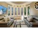 Comfortable living room with bay window and plush seating, filled with natural light at 1050 Carnoustie Ln, Alpharetta, GA 30005