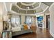 Serene main bedroom featuring a fireplace, sitting area, and tray ceiling at 1050 Carnoustie Ln, Alpharetta, GA 30005