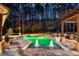 Inviting pool with water features, lush landscaping, and a pergola at 1050 Carnoustie Ln, Alpharetta, GA 30005