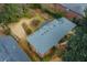 Aerial view of a home's roof and backyard, showcasing the lawn, mature trees, and landscaping at 42 W Belle Isle Ne Rd, Atlanta, GA 30342