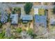 This aerial image shows a home in a residential area with mature trees and nice landscaping at 42 W Belle Isle Ne Rd, Atlanta, GA 30342