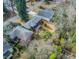 An aerial view shows a home with mature trees, a driveway, and nice landscaping at 42 W Belle Isle Ne Rd, Atlanta, GA 30342