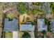 Aerial view of the backyard highlighting mature trees, landscaping, and proximity to adjacent homes at 42 W Belle Isle Ne Rd, Atlanta, GA 30342