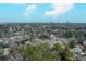 This is an aerial view of homes in a community with the city skyline in the far distance at 42 W Belle Isle Ne Rd, Atlanta, GA 30342