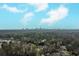 This aerial view shows the city skyline in the distance and homes in the foreground at 42 W Belle Isle Ne Rd, Atlanta, GA 30342