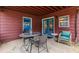 Back porch with outdoor seating and a mosaic-topped table, with a view of the backyard at 42 W Belle Isle Ne Rd, Atlanta, GA 30342