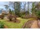 Manicured backyard with trees and various landscaping at 42 W Belle Isle Ne Rd, Atlanta, GA 30342