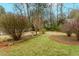 Lush backyard featuring a birdbath, healthy lawn, and established landscaping at 42 W Belle Isle Ne Rd, Atlanta, GA 30342