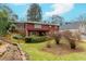 Exterior shot of charming two-story home with stairs and landscaped backyard at 42 W Belle Isle Ne Rd, Atlanta, GA 30342