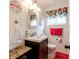 Cozy bathroom featuring flamingo-themed decor and a modern vanity with stylish fixtures at 42 W Belle Isle Ne Rd, Atlanta, GA 30342