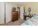 Bedroom showcasing a chest of drawers and a view into a connected room and closet at 42 W Belle Isle Ne Rd, Atlanta, GA 30342