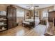 Charming bedroom with floral bedding, wooden floors, and abundant natural light at 42 W Belle Isle Ne Rd, Atlanta, GA 30342