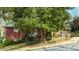 Single-story home with a covered porch, mature landscaping, and a well-maintained yard at 42 W Belle Isle Ne Rd, Atlanta, GA 30342