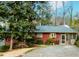 Charming single-story home with well-maintained landscaping and a screened-in porch at 42 W Belle Isle Ne Rd, Atlanta, GA 30342
