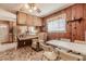 Cozy kitchen with wood paneling, seating, and natural light at 42 W Belle Isle Ne Rd, Atlanta, GA 30342