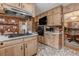 Kitchen featuring wood cabinets, stainless steel appliances, and an adjacent dining area at 42 W Belle Isle Ne Rd, Atlanta, GA 30342