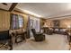 Cozy living room with furniture, ceiling beams, and double doors at 42 W Belle Isle Ne Rd, Atlanta, GA 30342