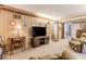 Comfortable living room with wood paneling, vintage furniture and a large television set at 42 W Belle Isle Ne Rd, Atlanta, GA 30342
