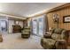 Comfortable living room with furniture, ceiling beams, and double doors at 42 W Belle Isle Ne Rd, Atlanta, GA 30342