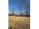 This home features a sprawling backyard and mature trees at 536 Joann Ave, Austell, GA 30168