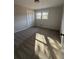 This bedroom features neutral walls, a large window, closet, and plush carpet at 536 Joann Ave, Austell, GA 30168