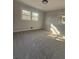 Bedroom featuring carpeting, neutral paint, and windows for natural light at 536 Joann Ave, Austell, GA 30168