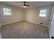 Cozy bedroom featuring carpeting, neutral paint, and windows for natural light at 536 Joann Ave, Austell, GA 30168