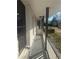 A long, enclosed front porch welcomes you, with its fresh white brick and dark trim at 536 Joann Ave, Austell, GA 30168