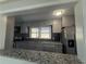 Open kitchen with bar top, stainless steel appliances, and updated cabinets at 536 Joann Ave, Austell, GA 30168