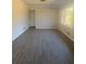Bright living area with windows, neutral paint, and light vinyl plank flooring at 536 Joann Ave, Austell, GA 30168
