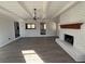 Cozy living room with painted brick fireplace and vinyl plank flooring at 536 Joann Ave, Austell, GA 30168