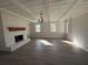 Spacious living room with exposed beam ceiling, refinished fireplace, and wood-look flooring at 536 Joann Ave, Austell, GA 30168