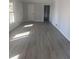 Living room featuring light walls, trim, and vinyl plank flooring at 536 Joann Ave, Austell, GA 30168