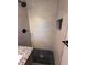 Beautiful shower with tiled walls, rainfall shower head, and granite topped half wall at 536 Joann Ave, Austell, GA 30168