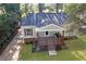 Aerial view of charming home with inviting porch swing and manicured landscaping at 2458 Calvin Ave, East Point, GA 30344