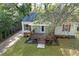 Aerial view of charming home with inviting porch and manicured landscaping at 2458 Calvin Ave, East Point, GA 30344