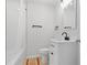 Fresh white bathroom with tiled shower and vanity at 2458 Calvin Ave, East Point, GA 30344